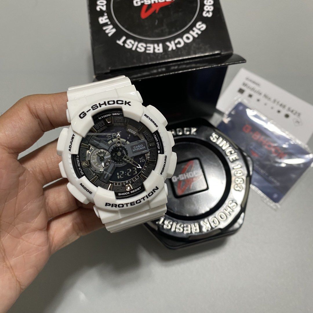 Casio G-Shock White Analog-Digital Watch (Category: Men's Watches) located in Imus. Submitted by fndsvntg_307 (Listing ID 1468890335, Image 2). Description: - 100% Authentic Casio G-Shock timepiece - Crisp white resin strap and bezel with black accents and orange illumination details - Ultimate durability: Shock-resistant build with 200-meter water resistance - Analog-digital dial setup for easy reading - Complete set: Includes original hexagonal