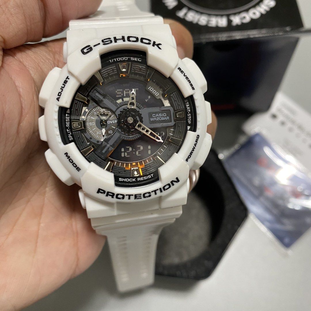 Casio G-Shock White Analog-Digital Watch (Category: Men's Watches) located in Imus. Submitted by fndsvntg_307 (Listing ID 1468890335, Image 3). Description: - 100% Authentic Casio G-Shock timepiece - Crisp white resin strap and bezel with black accents and orange illumination details - Ultimate durability: Shock-resistant build with 200-meter water resistance - Analog-digital dial setup for easy reading - Complete set: Includes original hexagonal