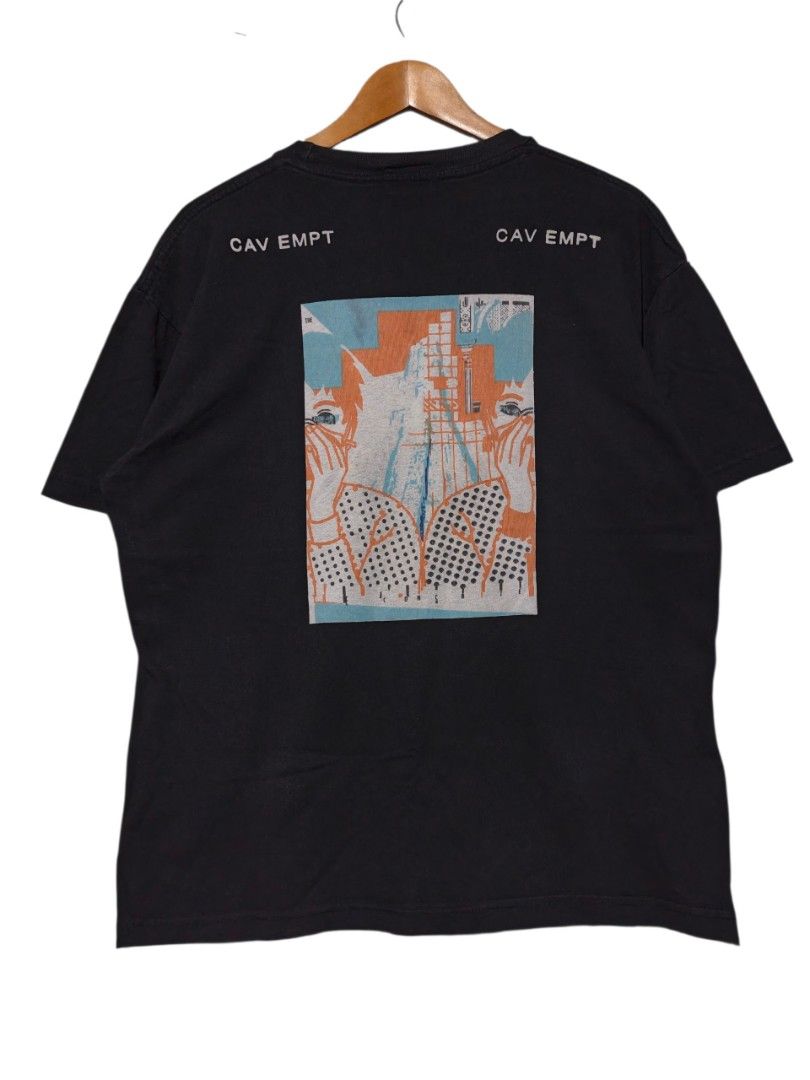Cav Empt C.E Graphic Print Black T-Shirt XL (Category: Tshirts & Polo Shirts ) located in Maasim. Submitted by ukayganda25 (Listing ID 1468770071, Image 2). Description: - Brand: Cav Empt - Color: Black - Size: XL (Chest: 23", Length: 27") - Material: 100% Cotton, Made in Japan - Design: Graphic print on front and back with text on shoulders - Origin: Potlatch Limited, Minami-Aoyama, Tokyo - Style: Standard crew neck.