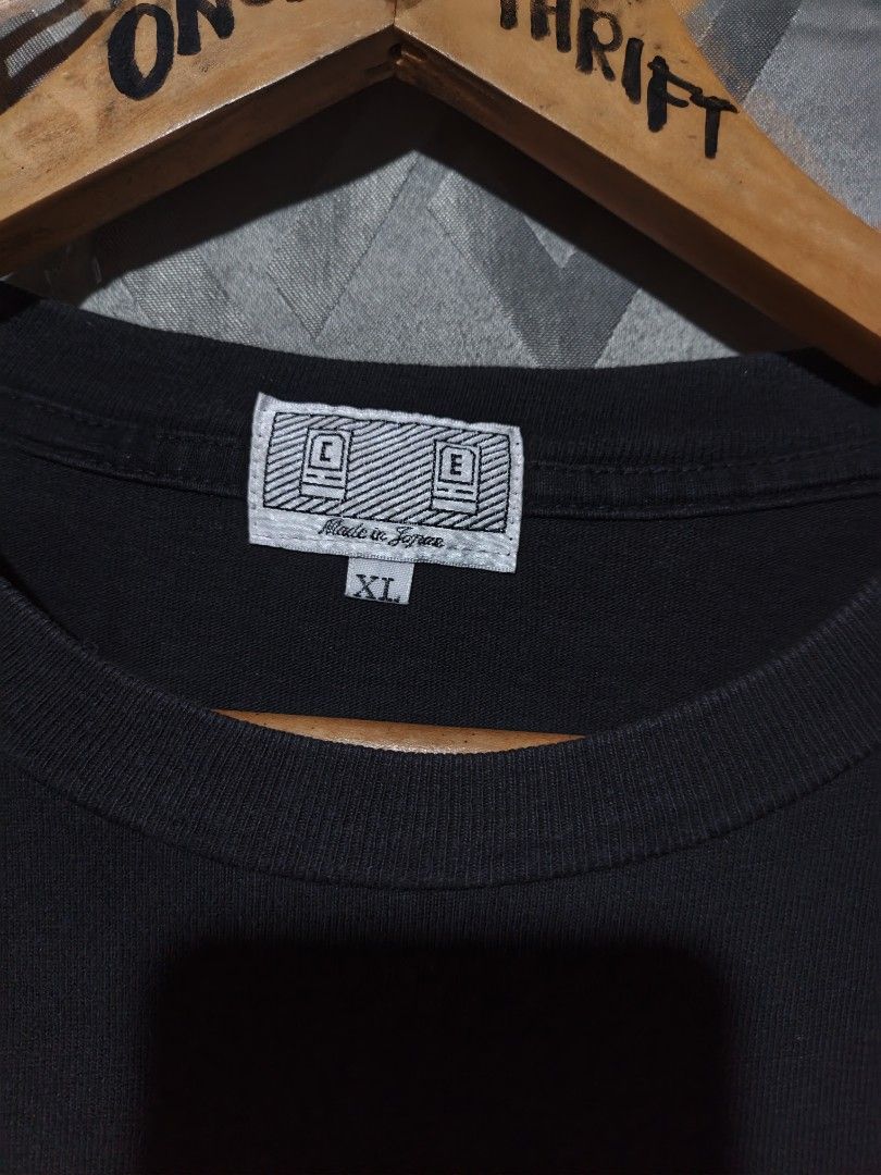 Cav Empt C.E Graphic Print Black T-Shirt XL (Category: Tshirts & Polo Shirts ) located in Maasim. Submitted by ukayganda25 (Listing ID 1468770071, Image 3). Description: - Brand: Cav Empt - Color: Black - Size: XL (Chest: 23", Length: 27") - Material: 100% Cotton, Made in Japan - Design: Graphic print on front and back with text on shoulders - Origin: Potlatch Limited, Minami-Aoyama, Tokyo - Style: Standard crew neck.