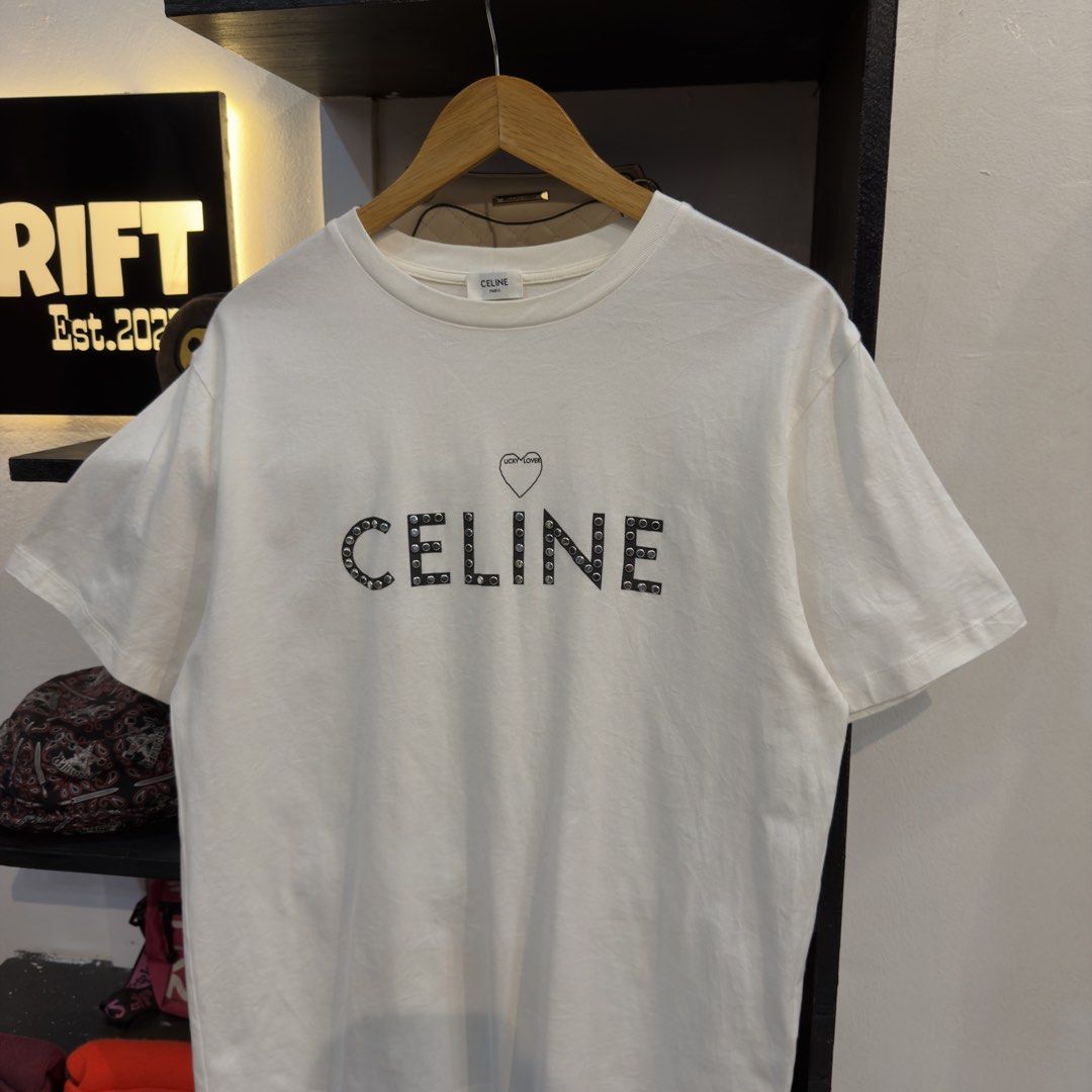 Celine by Hedi Slimane Studded White Shirt (Category: Tshirts & Polo Shirts ) located in Manila. Submitted by jerichomal82553 (Listing ID 1468899713, Image 2). Description: Celine by Hedi Slimane Studded White Shirt 21 by 27 Good Condition Complete Tags CLAIM 1300.