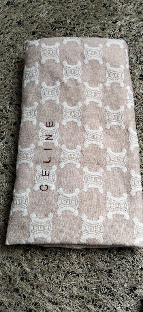 Celine Monogram Blanket Beige Cream (Category: Bedding & Towels) located in Paranaque City. Submitted by michael-08 (Listing ID 1468777759, Image 1). Description: - Authentic Celine blanket in beige and cream - Features all-over Triomphe monogram and embroidered Celine logo - Soft and cozy towel-like texture - Dimensions: 110cm x 70cm - Comes with original fabric tags attached - Perfect for home styling or gifting AUTHENTIC CELINE WITH HANG TAGG 
