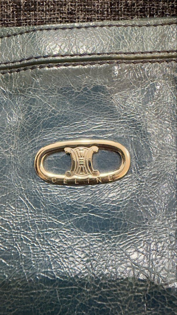Celine Teal Leather Tote/Shoulder Bag (Category: Luxury Bags & Wallets) located in Calamba. Submitted by doublegm (Listing ID 1468814726, Image 2). Description: - Authentic Celine blue textured leather tote bag - Double shoulder straps with sturdy metal hardware links - Front oval plaque featuring engraved Celine branding - Vibrant, colorful chain-link pattern fabric interior lining - Secure magnetic snap closure with an internal zippered pocket 