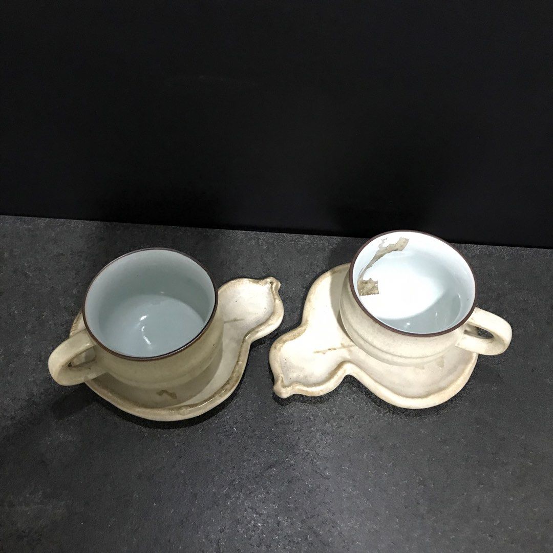 Ceramic Teacup and Gourd Shaped Saucer Set (Category: Coffee & Tea Tableware) located in Baao. Submitted by all.things.japan (Listing ID 1468747994, Image 2). Description: - Set includes: 2 ceramic teacups and matching gourd-shaped saucers - Design: Beige textured exterior with a glossy white interior and stylish brown rims - Aesthetic: Unique handmade style, perfect for everyday use or aesthetic table settings - Ideal for: Afternoon tea, coffee,