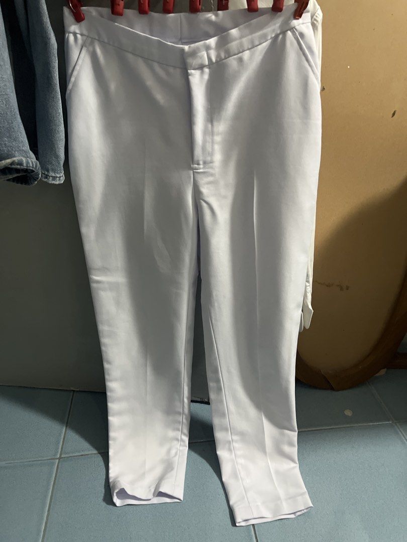 CEU Pharmacy Uniform (Category: Shirts) located in Antipolo. Submitted by Wenchisells (Listing ID 1468864560, Image 3). Description: Centro Escolar University uniform top in white. Short sleeves with a mandarin collar style neckline. Asymmetrical button-down front with light blue buttons. Embroidered CEU patch logo on the left chest area. Includes two front pockets near the hem. White pants with two pockets. - Patahi (but around L-XL size from CE