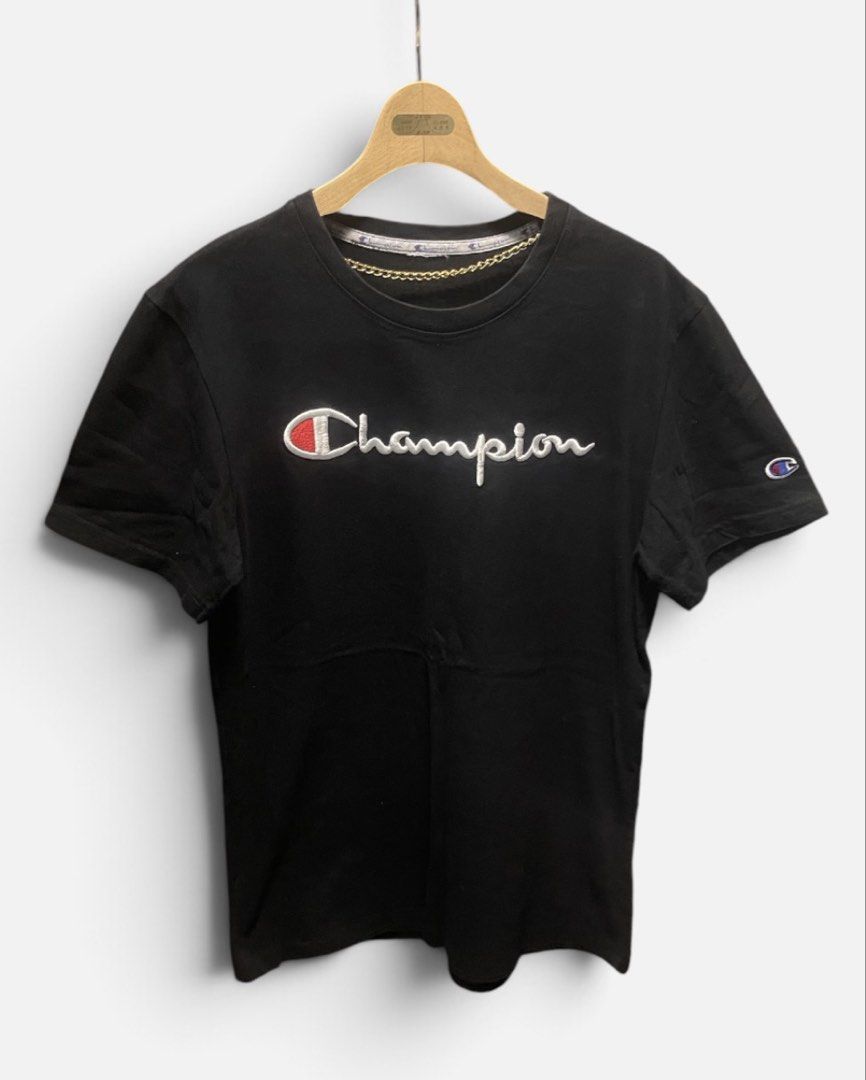 Champion Black Script Logo Embroidered T-Shirt (Category: Shirts) located in San Pedro. Submitted by lifebeginsaftercoff33 (Listing ID 1468817638, Image 2). Description: - Authentic black Champion t-shirt - Dimes: 18 x 26 in - Large embroidered script logo across the chest - Signature small 'C' patch embroidered on the left sleeve - Comfortable crew neck with branded inner taping - Classic fit, perfect for casual streetwear - Clean condition with
