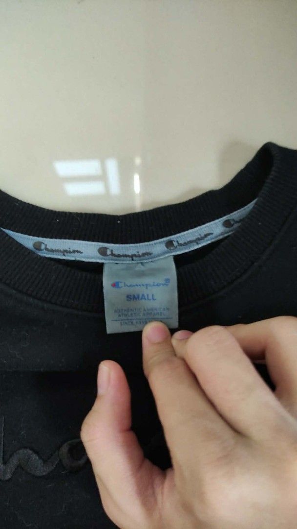 Champion Black Sweatshirt Size Small (Category: Coats, Jackets and Outerwear) located in Rizal. Submitted by silenttiger_43bf91 (Listing ID 1468783721, Image 3). Description: - Brand: Champion - Color: Black - Size: Small - Design: Embroidered script logo on chest and iconic C patch on left cuff - Fit: Classic crewneck with ribbed cuffs and hem - Material: Warm and comfortable cotton blend - Condition: Excellent, perfect for daily wear Pm for mor