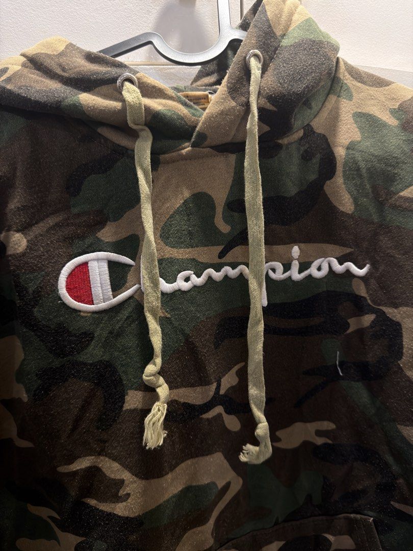 Champion Camo Script Hoodie (Category: Coats, Jackets and Outerwear) located in Manila. Submitted by johnlee0212 (Listing ID 1468877633, Image 2). Description: Champion Camouflage Script Logo Size on tag: Medium Dimes: W: 21 x L: 26 No issue Location: Cubao.