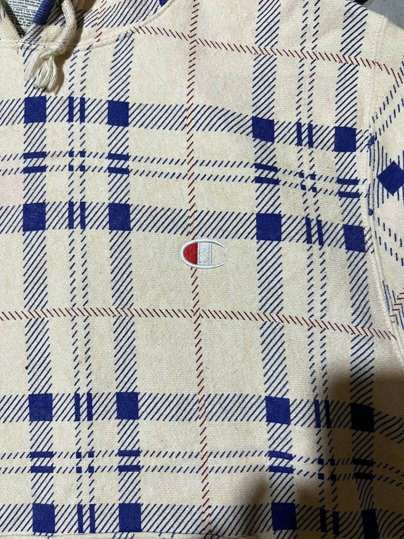 Champion Reverse Weave Plaid Hoodie (Category: Hoodies) located in Taguig. Submitted by 22nd_street_thrift (Listing ID 1468749960, Image 2). Description: - Brand: Champion Reverse Weave - Size: Medium (Standard heavyweight, boxy fit) - Design: Rare all-over blue and red plaid pattern on a cream base - Features: Drawstring hood, front kangaroo pocket, embroidered logo patch on chest and left cuff - Origin: Made in Vietnam - Condition: Excellent, r