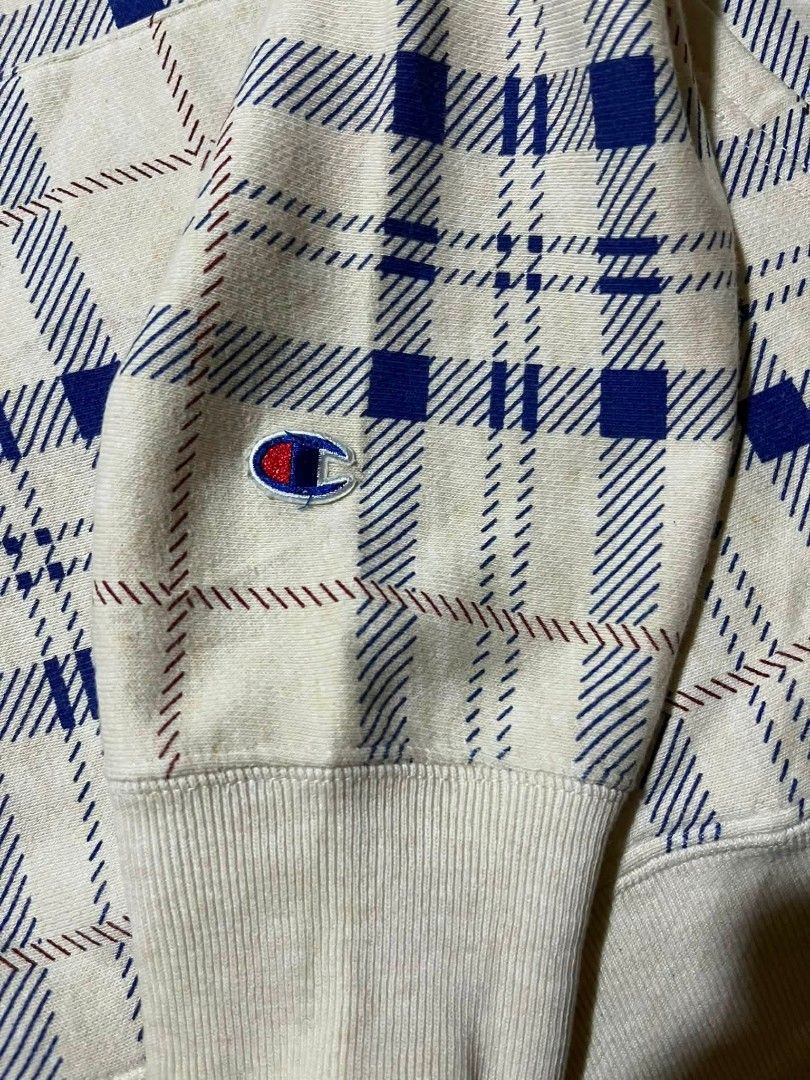 Champion Reverse Weave Plaid Hoodie (Category: Hoodies) located in Taguig. Submitted by 22nd_street_thrift (Listing ID 1468749960, Image 3). Description: - Brand: Champion Reverse Weave - Size: Medium (Standard heavyweight, boxy fit) - Design: Rare all-over blue and red plaid pattern on a cream base - Features: Drawstring hood, front kangaroo pocket, embroidered logo patch on chest and left cuff - Origin: Made in Vietnam - Condition: Excellent, r