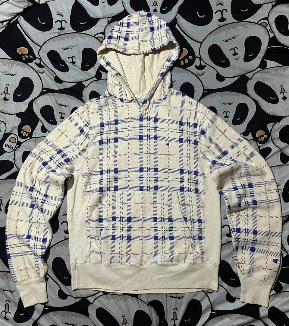 Champion Reverse Weave Plaid Hoodie (Category: Hoodies) located in Taguig. Submitted by 22nd_street_thrift (Listing ID 1468749960, Image 1). Description: - Brand: Champion Reverse Weave - Size: Medium (Standard heavyweight, boxy fit) - Design: Rare all-over blue and red plaid pattern on a cream base - Features: Drawstring hood, front kangaroo pocket, embroidered logo patch on chest and left cuff - Origin: Made in Vietnam - Condition: Excellent, r