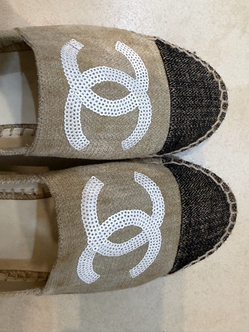 Chanel Canvas Espadrilles Beige Black CC Logo Size 38 (Category: Sneakers & Footwear) located in Quezon City. Submitted by oliviapalermo (Listing ID 1468800613, Image 2). Description: - Brand: Chanel - Style: Slip-on flat espadrilles - Color/Material: Beige canvas with black toes and jute rope trim - Design: Iconic white sequin CC logo on top - Condition: Normal signs of wear on insoles and uppers - Inclusions: black box and dust bag - RFS: not w