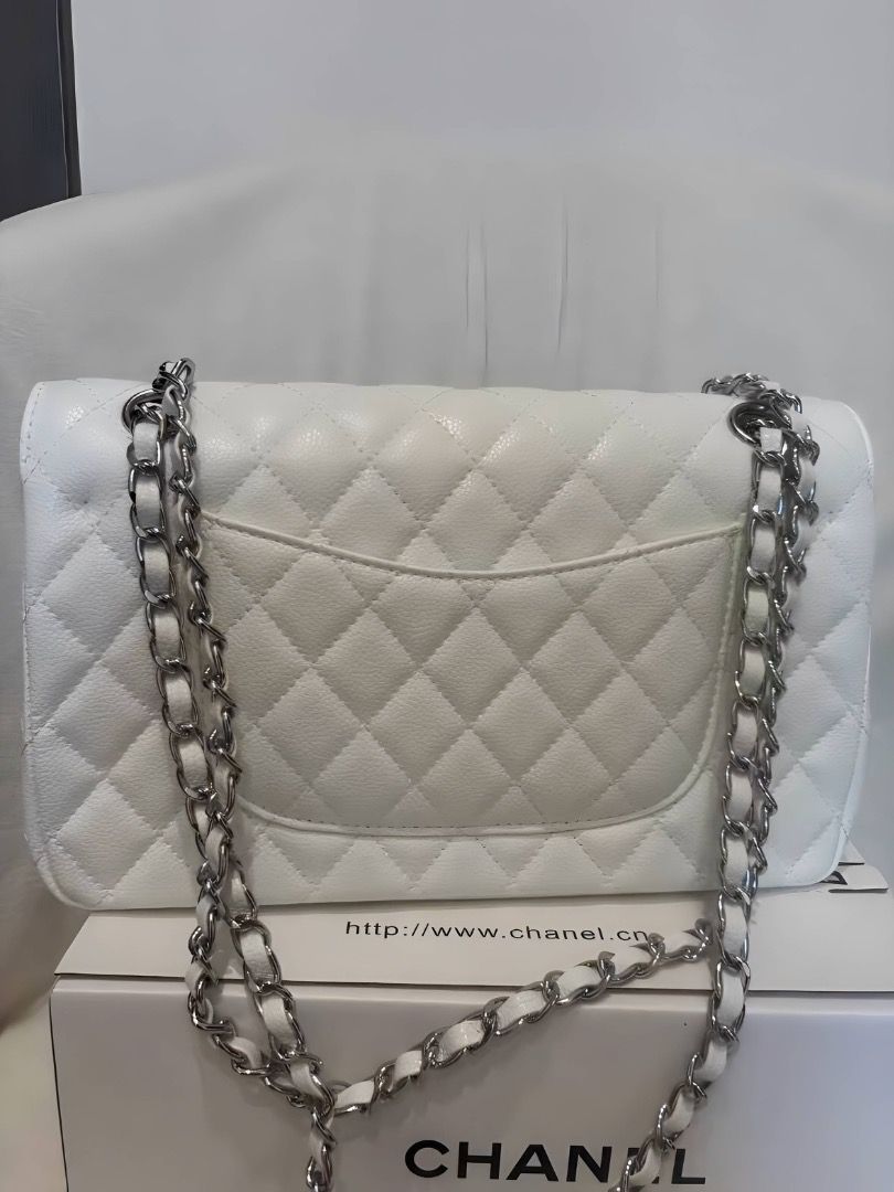 Chanel Classic Double Flap White (Category: Luxury Bags & Wallets) located in Las Pinas. Submitted by moonlaight (Listing ID 1468875535, Image 2). Description: Condition: Almost brand new Size: Medium Comes with the box and dust bag!.