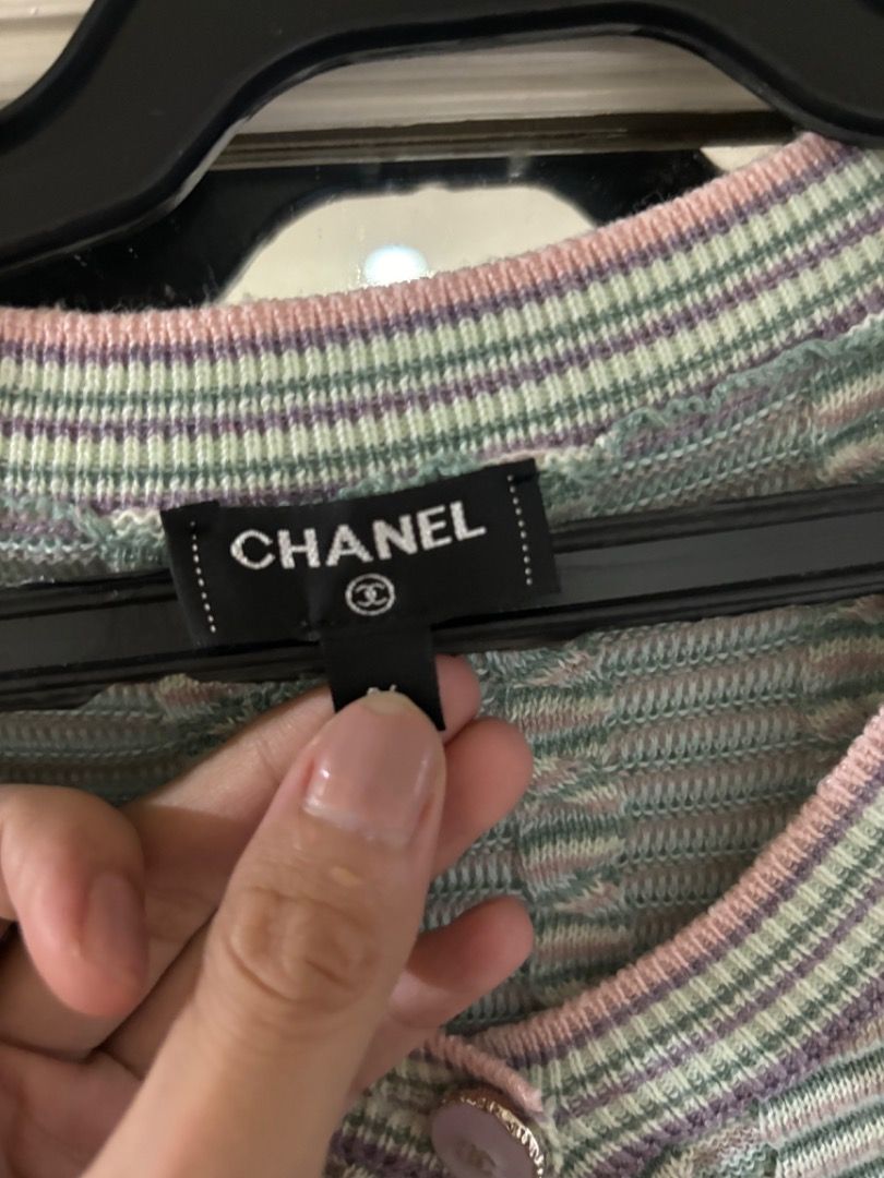 CHANEL Knit Cardigan (Category: Coats, Jackets and Outerwear) located in Makati City. Submitted by bravelion-b2bc (Listing ID 1468907706, Image 3). Description: - Brand: CHANEL - Style: Pastel multicolor stripe knit cardigan as seen on Jennie - Details: Round neckline, button front closure, front patch pockets - Material: Soft ribbed knit throughout - Authenticity: Features iconic CC logo tag inside near the collar - Condition: Excellent luxury p