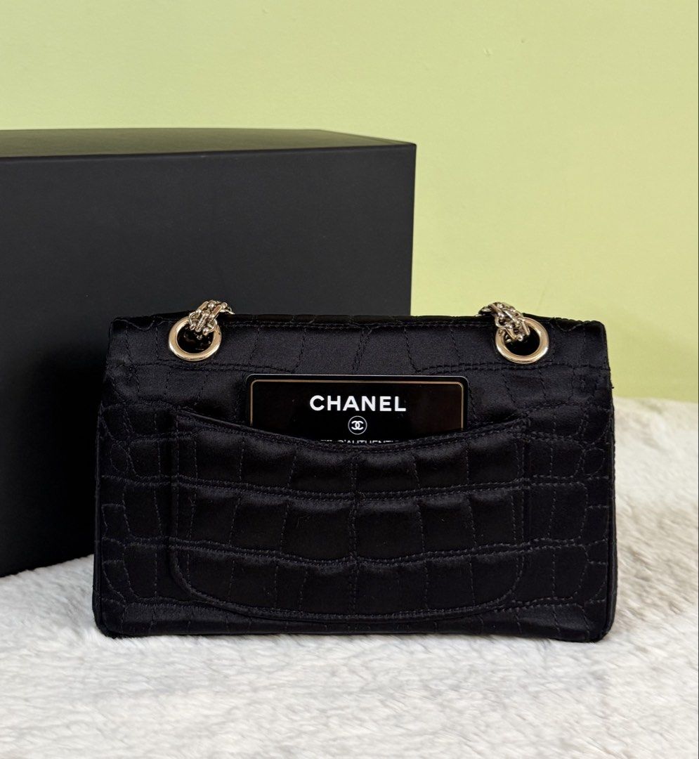 Chanel Reissue Small black (Category: Luxury Bags & Wallets) located in Manila. Submitted by rellamaaim07341 (Listing ID 1468884266, Image 2). Description: Black Quilted Satin Embossed Crocodile 2.55 Small ‼️Rank A‼️ Series 12 Comes with Dust bag,Card Holo Intact .