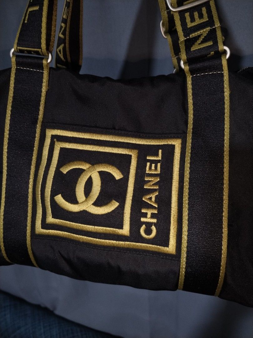 Chanel Sport Duffel Bag (Category: Luxury Bags & Wallets) located in Pasig City. Submitted by loveforlux_2025 (Listing ID 1468717022, Image 2). Description: - Stylish black canvas duffel bag with lime green accents and embroidered Chanel logos - Roomy interior, ideal for gym gear or daily essentials - Double straps with adjustable buckles for a comfortable fit - Convenient mesh pocket on the end for extra storage - Secure zipper closure across th