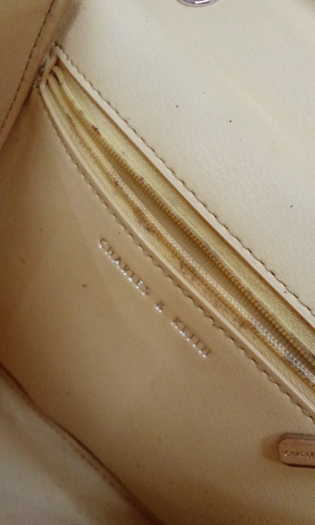 CHARLES & KEITH (Category: Luxury Bags & Wallets) located in Muntinlupa City. Submitted by feolinohoward92 (Listing ID 1468748607, Image 3). Description: butter-yellow structured handbag with a mock-crocodile embossed finish and a push-lock closure, resembling the Charles & Keith Croc-Effect Structured Bag..