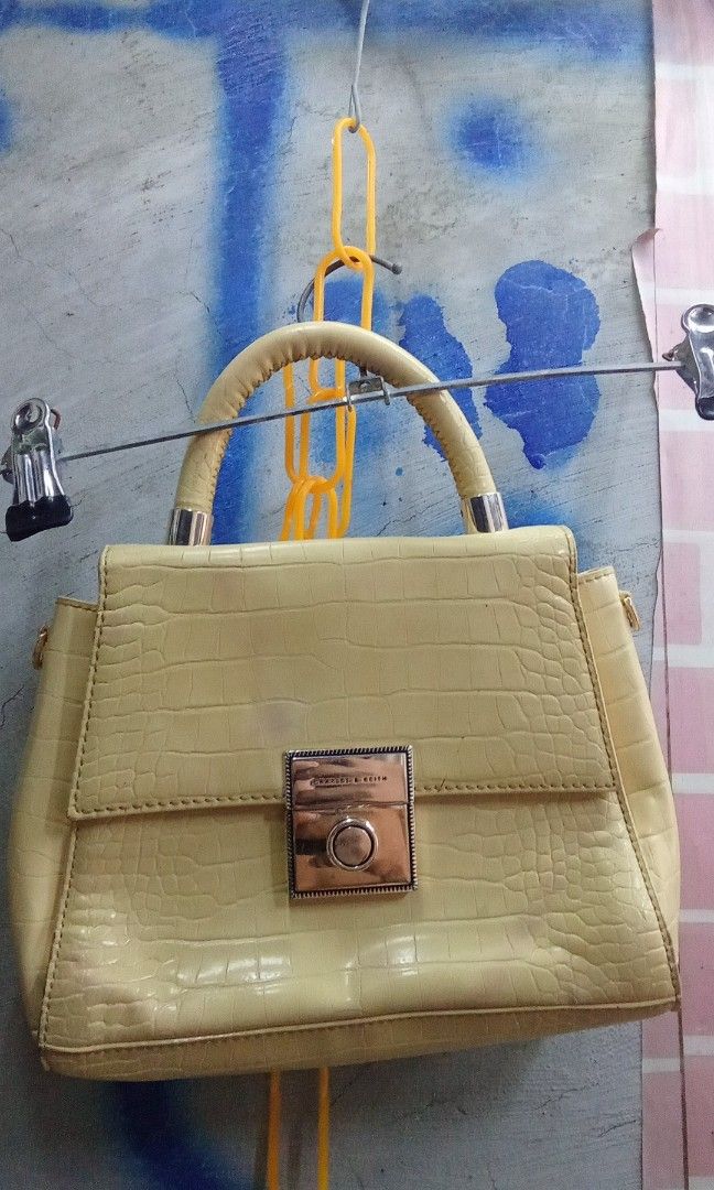 CHARLES & KEITH (Category: Luxury Bags & Wallets) located in Muntinlupa City. Submitted by feolinohoward92 (Listing ID 1468748607, Image 1). Description: butter-yellow structured handbag with a mock-crocodile embossed finish and a push-lock closure, resembling the Charles & Keith Croc-Effect Structured Bag..