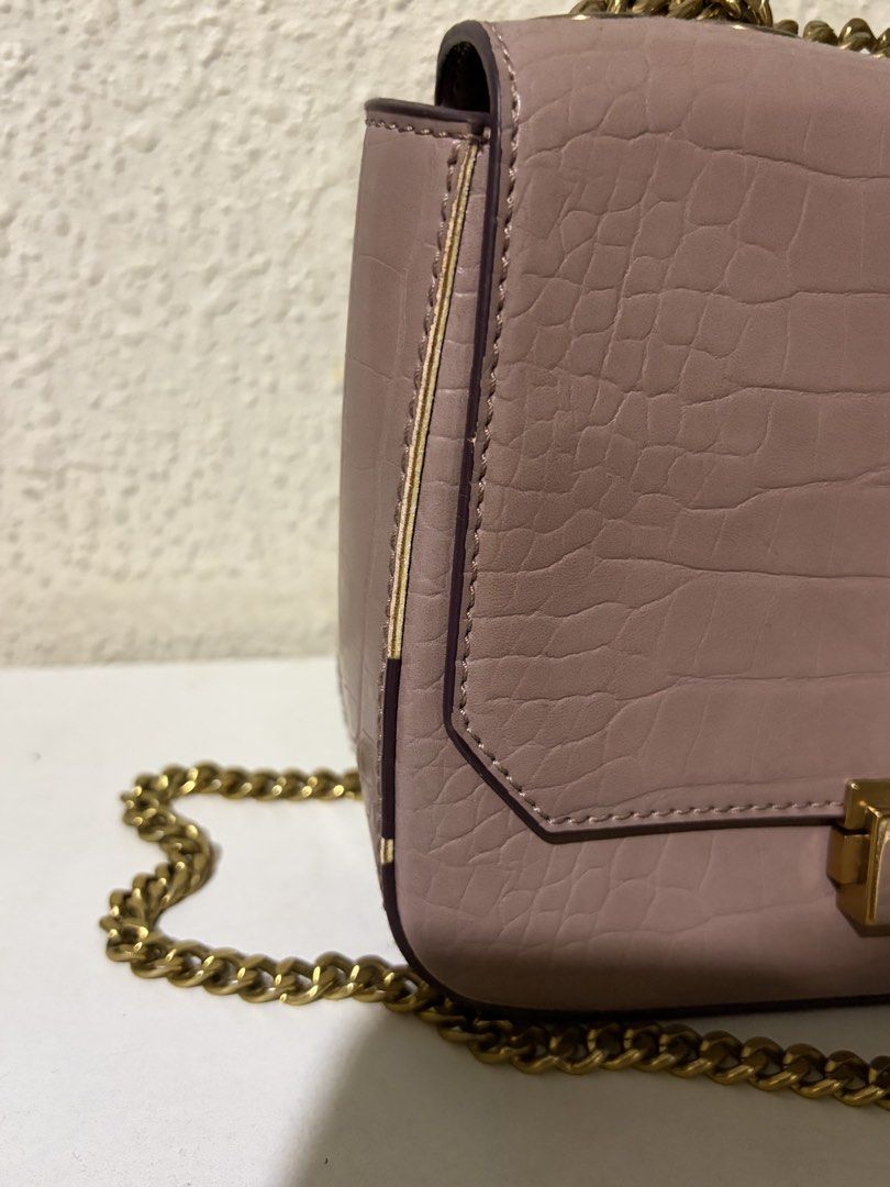 Charles & Keith Croc-Effect Structured Crossbody Bag (Category: Cross-body Bags) located in Quezon City. Submitted by sarisaringdamit.dyg (Listing ID 1468882249, Image 2). Description: Charles & Keith Croc-Effect Structured Crossbody Bag in a mauve or dusty pink color..