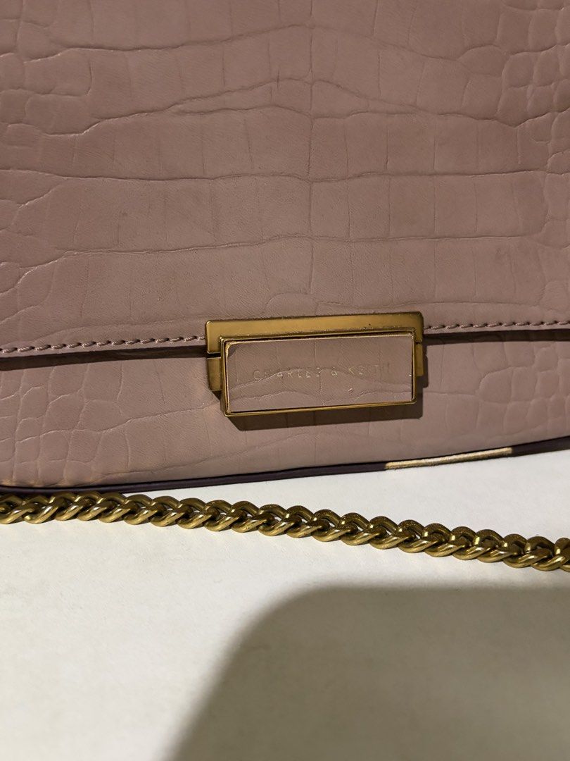 Charles & Keith Croc-Effect Structured Crossbody Bag (Category: Cross-body Bags) located in Quezon City. Submitted by sarisaringdamit.dyg (Listing ID 1468882249, Image 3). Description: Charles & Keith Croc-Effect Structured Crossbody Bag in a mauve or dusty pink color..