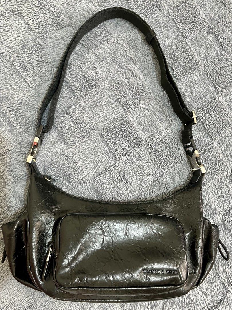 Charles & Keith Soleil Crinkle-Effect Shoulder Bag - Noir (Category: Shoulder Bags) located in Mandaluyong City. Submitted by leypadilla (Listing ID 1468733911, Image 2). Description: - Brand/Model: Charles & Keith Soleil shoulder bag - Color: Noir black with stylish crinkle-effect finish - Hardware: Sleek silver-tone accents - Storage: Convenient front zip pocket and secure main zipper closure - Details: Adjustable strap with buckle and side pul