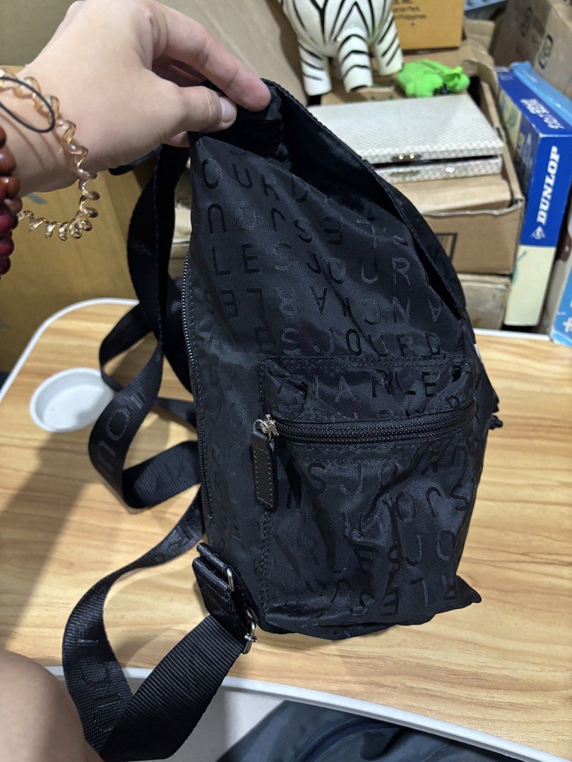 CHARLES JOURDAN Logo Backpack (Category: Backpacks) located in Calamba. Submitted by alnsurplus.028 (Listing ID 1468733610, Image 3). Description: CHARLES JOURDAN Logo Backpack black Charles Jourdan monogram nylon backpack with a front flap buckle and zip pocket Like new condition No issue We ship nationwide Lalamove/J&T Loc: Calamba, Laguna.