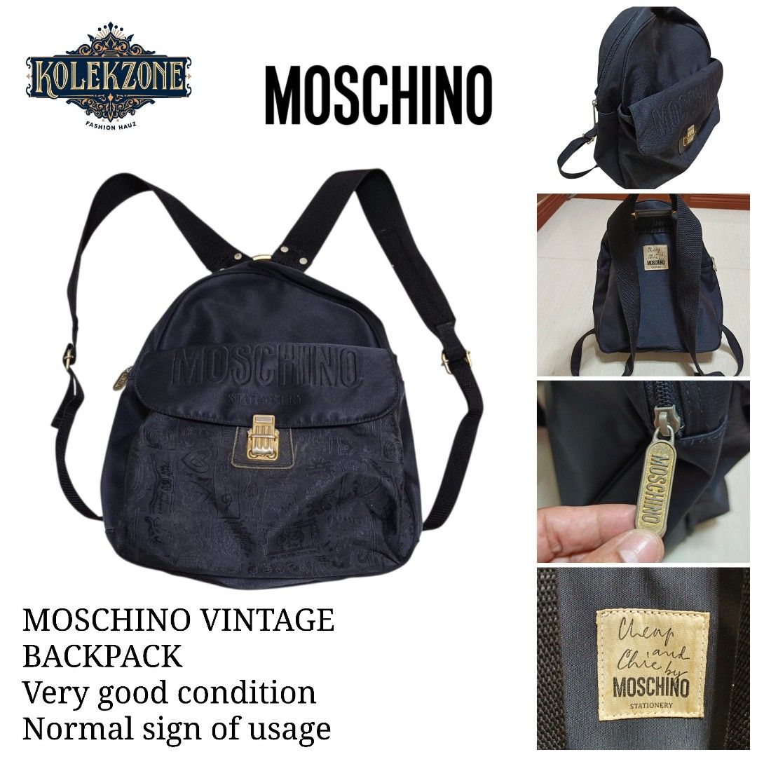 Cheap and Chic by Moschino Vintage Backpack (Category: Backpacks) located in Nasugbu. Submitted by staffpicks1515 (Listing ID 1468789890, Image 1). Description: - Brand: Cheap and Chic by Moschino - Material: Durable black canvas - Design: Embroidered Moschino lettering, gold-tone clasp, and subtle doodle pattern on the lower front - Features: Top zipper closure, adjustable fabric shoulder straps, and top carry ring - Interior: Includes signature