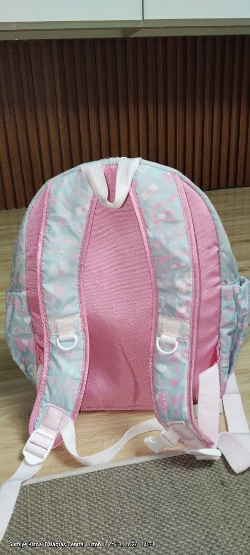 Cherish Cute Pastel Bows Girls Backpack (Category: Backpacks) located in Guiguinto. Submitted by ambershelb75728 (Listing ID 1468769511, Image 2). Description: - Design: Adorable light blue and pink backpack with an all-over ribbon and heart pattern - Special Feature: Sparkling "Cherish" glitter lettering on the front - Pockets: Front zipped pocket with a stylish ruffled trim and convenient side pockets for water bottles - Comfort: Pink padded sh