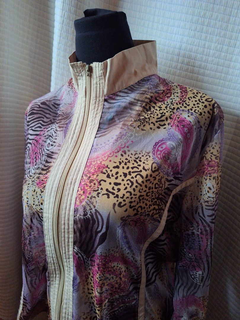 Chic patterned zip-up jacket with beige panels (Category: Coats, Jackets and Outerwear) located in Balamban. Submitted by ubethan (Listing ID 1468895855, Image 2). Description: - Eye-catching mix of vibrant animal prints and paisley patterns - Cream beige contrast panels on the collar, shoulders, placket, and back yoke - Lightweight fabric ideal for layering - Full front zipper closure with a structured stand-up collar - Long sleeves finished wit