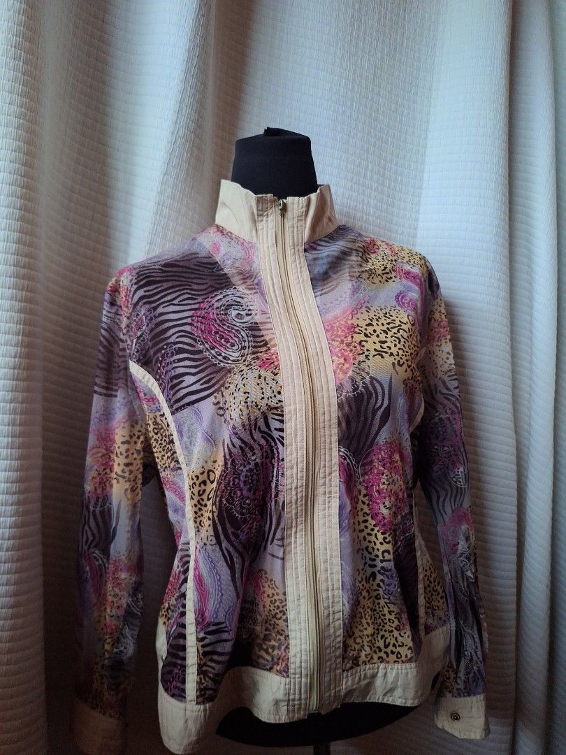 Chic patterned zip-up jacket with beige panels (Category: Coats, Jackets and Outerwear) located in Balamban. Submitted by ubethan (Listing ID 1468895855, Image 1). Description: - Eye-catching mix of vibrant animal prints and paisley patterns - Cream beige contrast panels on the collar, shoulders, placket, and back yoke - Lightweight fabric ideal for layering - Full front zipper closure with a structured stand-up collar - Long sleeves finished wit
