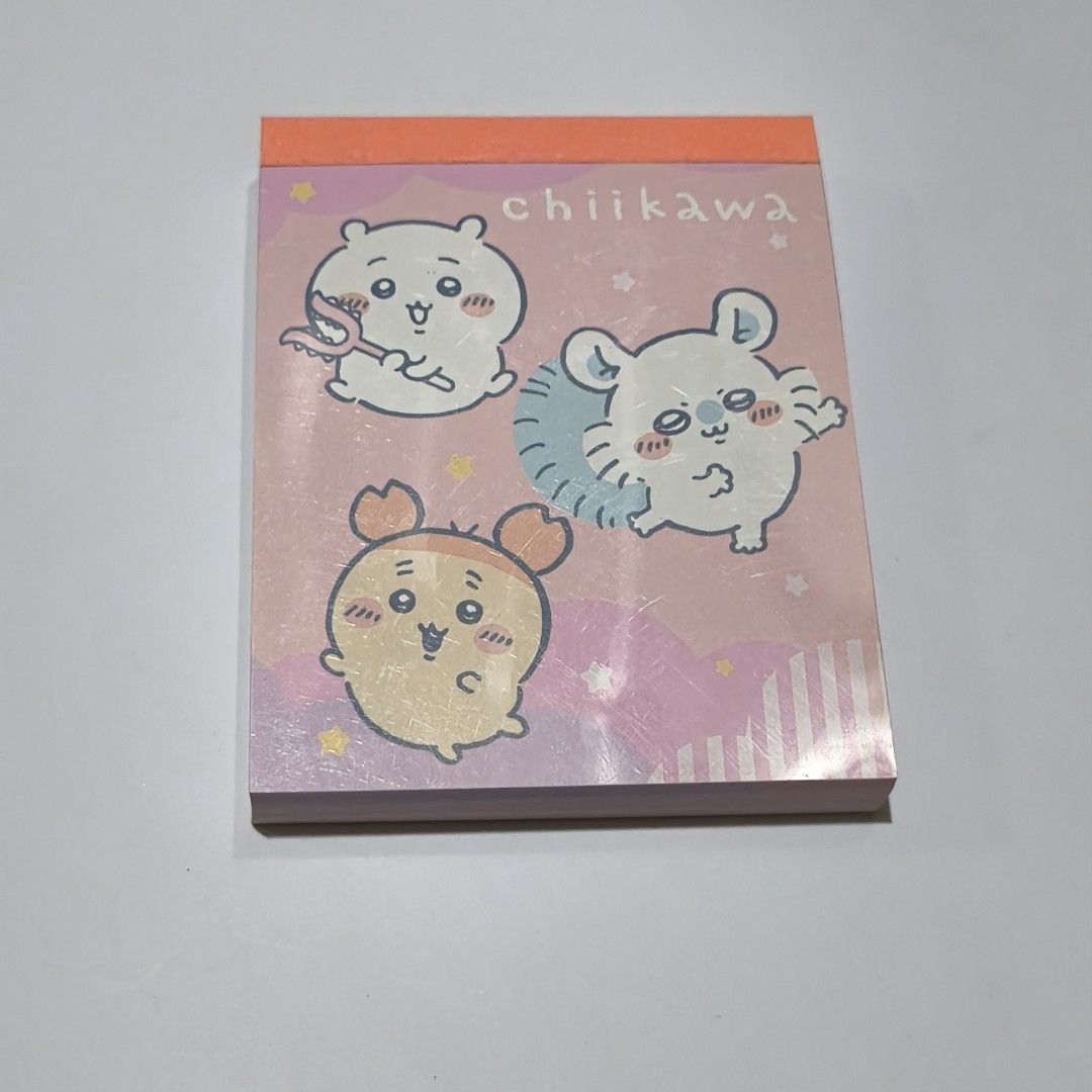 Chiikawa Memo Pad Note Pad Stationery Pink (Category: Stationery & School Supplies) located in Manila. Submitted by abbey.lee (Listing ID 1468900653, Image 1). Description: - 100% Official Nagano / Chiikawa committee merch - Features popular characters: Chiikawa, Hachiware, and Usagi - Contains multiple cute pastel page designs - Unused block with vibrant pink and purple tones - Perfect for journaling, school work, or desk notes - Condition: Bran