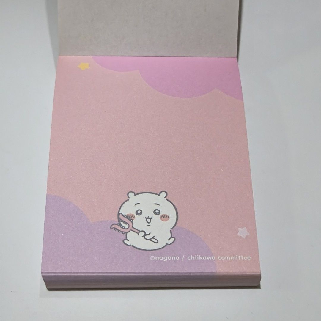 Chiikawa Memo Pad Note Pad Stationery Pink (Category: Stationery & School Supplies) located in Manila. Submitted by abbey.lee (Listing ID 1468900653, Image 2). Description: - 100% Official Nagano / Chiikawa committee merch - Features popular characters: Chiikawa, Hachiware, and Usagi - Contains multiple cute pastel page designs - Unused block with vibrant pink and purple tones - Perfect for journaling, school work, or desk notes - Condition: Bran