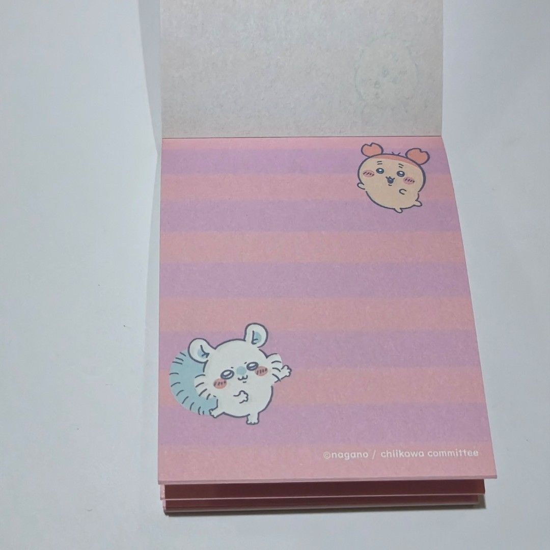 Chiikawa Memo Pad Note Pad Stationery Pink (Category: Stationery & School Supplies) located in Manila. Submitted by abbey.lee (Listing ID 1468900653, Image 3). Description: - 100% Official Nagano / Chiikawa committee merch - Features popular characters: Chiikawa, Hachiware, and Usagi - Contains multiple cute pastel page designs - Unused block with vibrant pink and purple tones - Perfect for journaling, school work, or desk notes - Condition: Bran