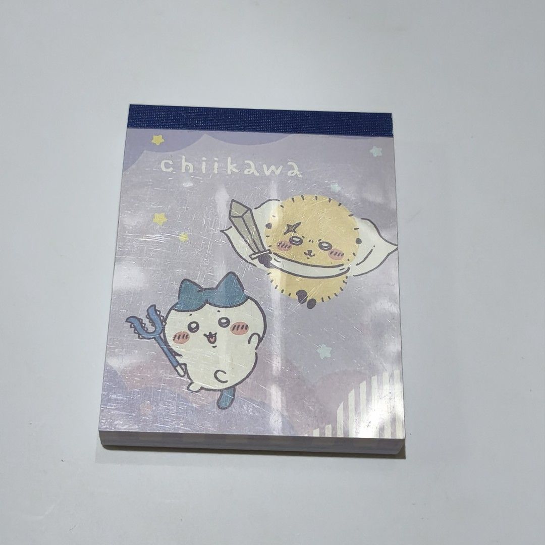 Chiikawa Notepad memo pad official merchandise Light Blue (Category: Stationery & School Supplies) located in Manila. Submitted by abbey.lee (Listing ID 1468900946, Image 1). Description: - Authentic Chiikawa & Kuriboh fantasy costume design - Official Nagano merchandise - Beautiful purple cover - Lined pages featuring cute tiny stars and character art at the top - Perfect for daily notes, journaling, or collecting.