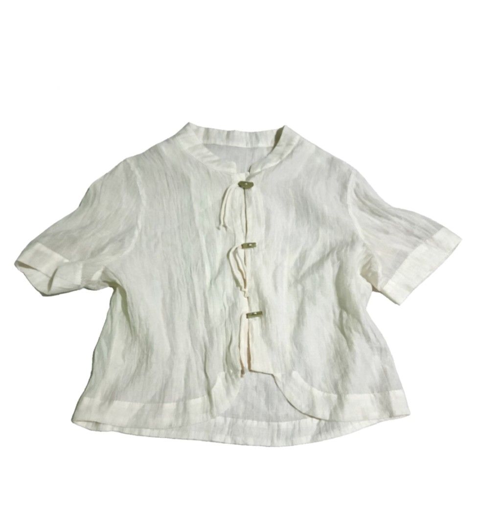 Chinese Blouse Long sleeves (Category: Blouses) located in Muntinlupa City. Submitted by zeezeesells_cloud (Listing ID 1468739977, Image 1). Description: White short sleeve linen blouse featuring a mandarin collar, decorative front buttons, and a curved waist-length hem. A clean, minimalist casual top perfect for warm weather..
