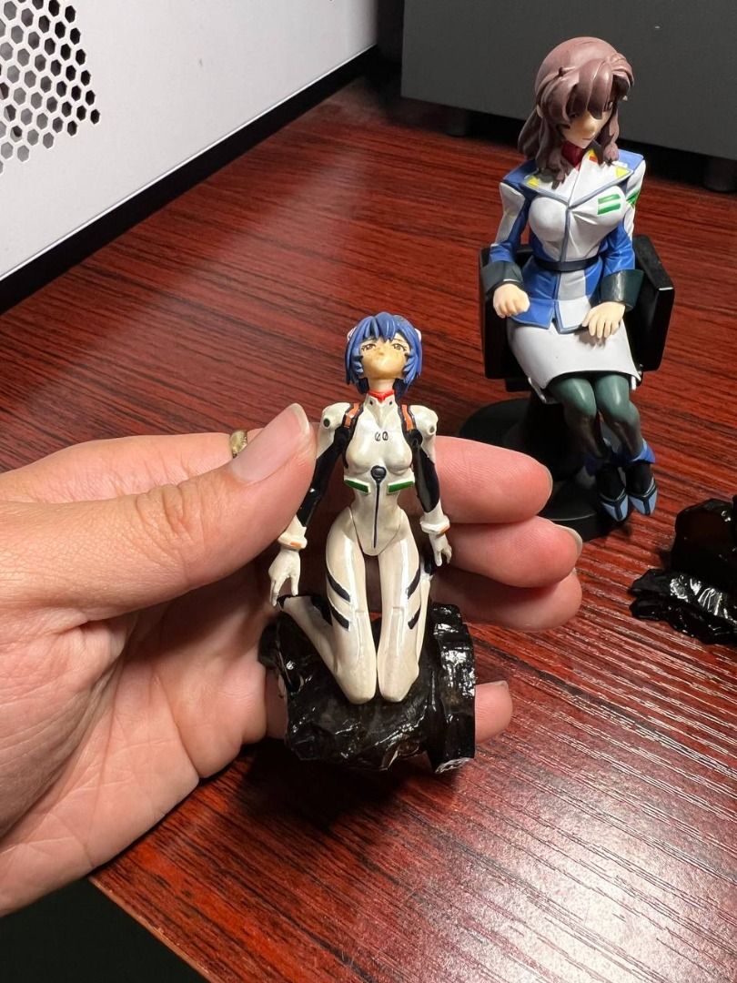 Chix Anime Figurine Set (Category: Figurines & Statues) located in Baguio. Submitted by ditoyzb08176 (Listing ID 1468856814, Image 3). Description: - Set of 3 Neon Genesis Evangelion anime figures - Includes Rei Ayanami kneeling on base, Misato Katsuragi sitting in chair, and Asuka Langley in red plugsuit on rock base - Great for shelf display and collection - Sold as set' Location: Baguio City Shipping: J&T/FLASH/LBC .