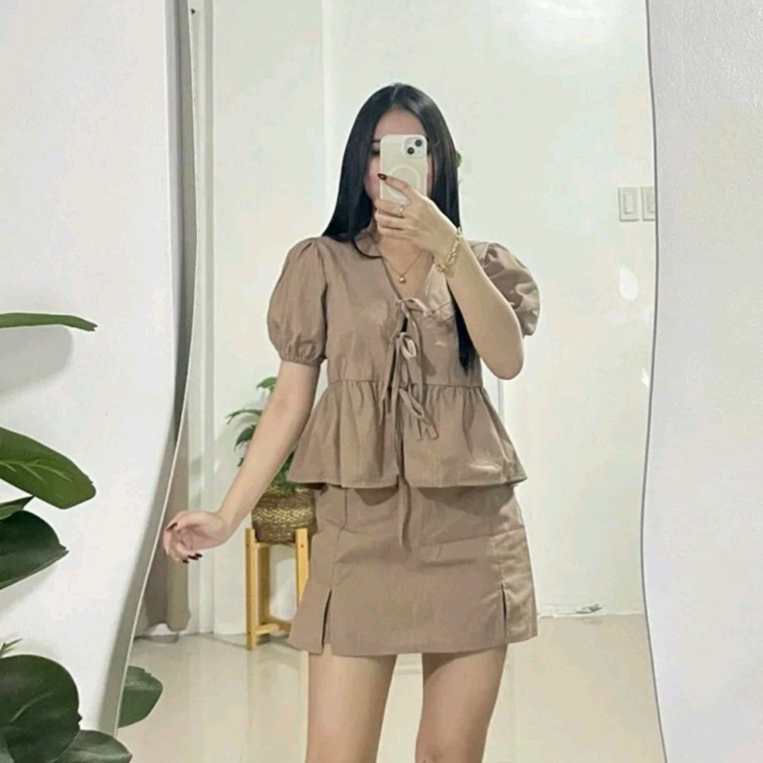 Choco Brown Puff Sleeve Top And Skirt Set Rowan Coordinates (Category: Sets or Coordinates) located in Marilao. Submitted by aaiyaa (Listing ID 1468831490, Image 1). Description: - Color: Choco brown - Style: Two-piece outfit (top and matching mini skirt) - Top details: Short puff sleeves, front tie strings, ruffle hem - Skirt details: Small front slits - Fabric: Soft and comfortable for everyday wear - Size: Free size (fits small to medium frame