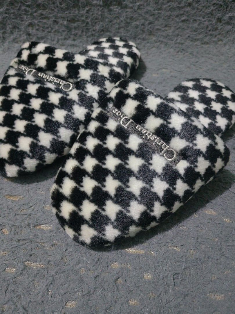 Christian Dior Houndstooth Slippers (Category: Sneakers & Footwear) located in Las Pinas. Submitted by huslerz (Listing ID 1468819018, Image 2). Description: - Brand: Christian Dior - Style: Slip-on house slippers - Design: Classic black and white houndstooth pattern with a soft fuzzy upper - Details: Small woven Dior brand tag on top - Sole: Black synthetic leather with anti-slip texture - Condition: Brand new with original stickers still attach
