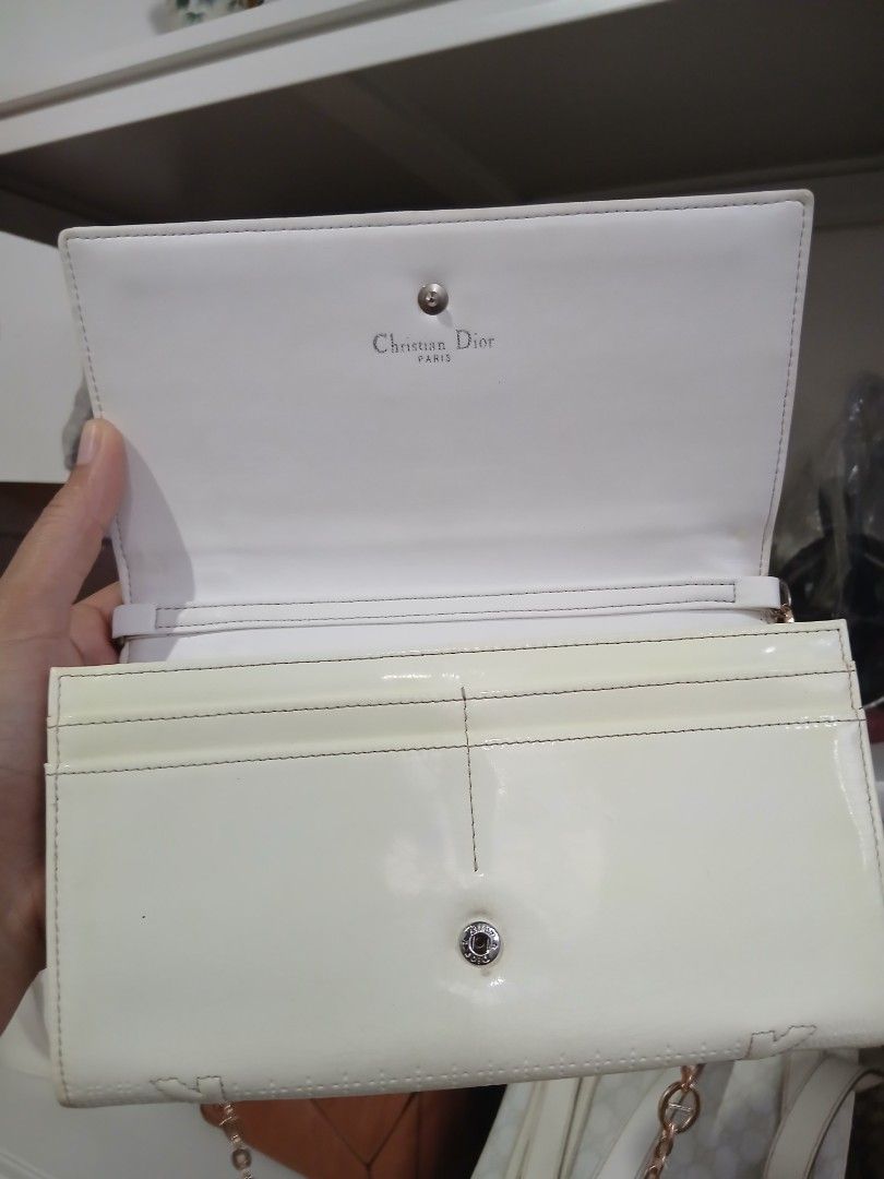 Christian Dior White Leather Chain Shoulder Bag (Category: Luxury Bags & Wallets) located in Alaminos. Submitted by sachiKaSan (Listing ID 1468857743, Image 2). Description: - Brand: Authentic Christian Dior - Style: Wallet on Chain / Crossbody / Clutch - Color: White leather with gold-tone hardware - Closure: Front flap with signature Dior lock - Interior: White leather and fabric lining with card slots, compartments, and a zippered pocket - Ori