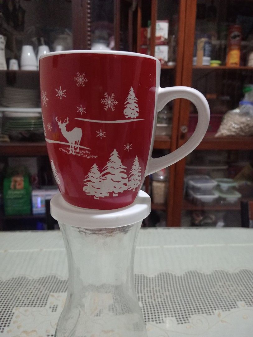 Mark's & Spencer Christmas Coffee Mug (Category: Coffee & Tea Tableware) located in Makati City. Submitted by YSL80022 (Listing ID 1468738311, Image 1). Description: - Festive red ceramic mug with white holiday graphics - Brand; Mark's & Spencer - Features cute pine trees, deer, and snowflakes all around - Clean white interior and comfortable white handle - Standard size, ideal for coffee, tea, hot cocoa, and holiday drinks - Brand new and ready 