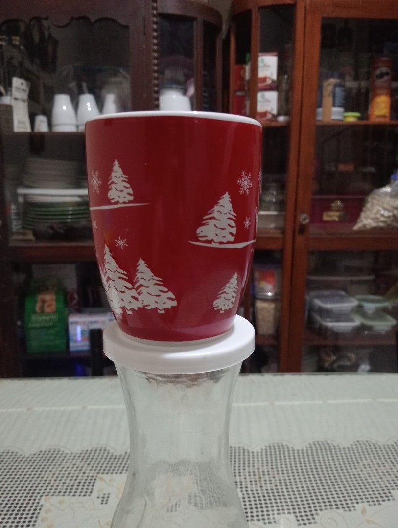 Mark's & Spencer Christmas Coffee Mug (Category: Coffee & Tea Tableware) located in Makati City. Submitted by YSL80022 (Listing ID 1468738311, Image 3). Description: - Festive red ceramic mug with white holiday graphics - Brand; Mark's & Spencer - Features cute pine trees, deer, and snowflakes all around - Clean white interior and comfortable white handle - Standard size, ideal for coffee, tea, hot cocoa, and holiday drinks - Brand new and ready 