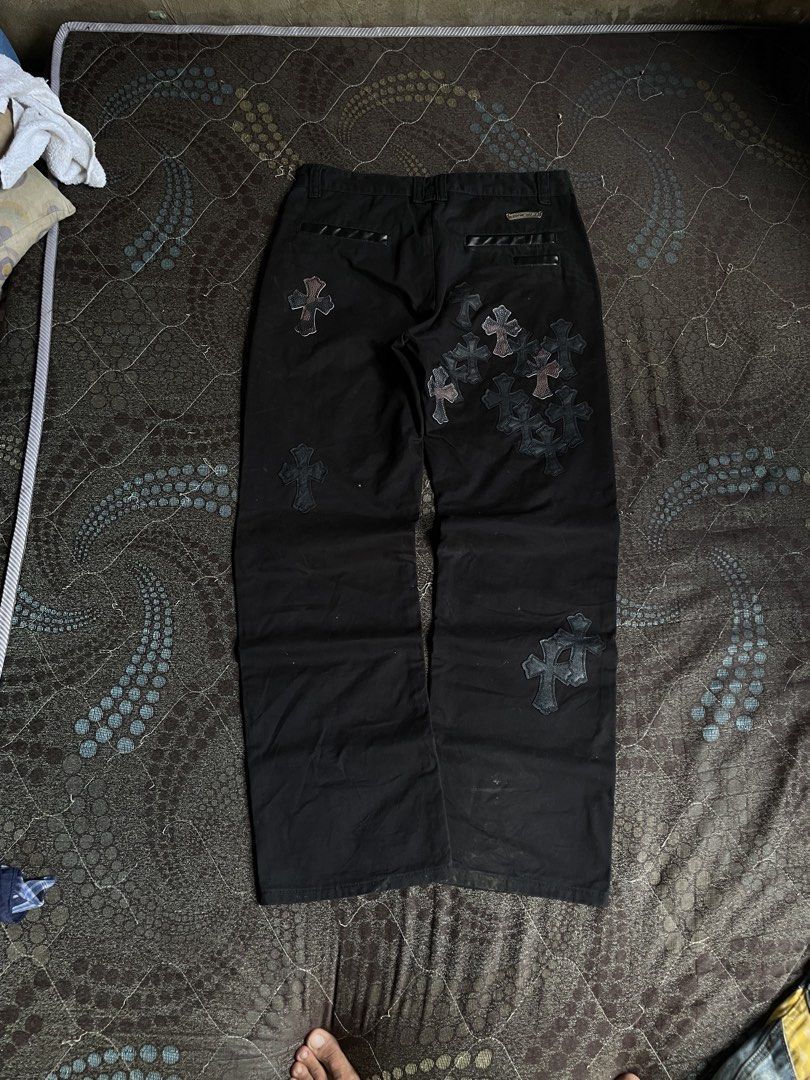 Chrome Hearts Cross Patch Black Pants (Category: Jeans) located in Manila. Submitted by chawmichael (Listing ID 1468880468, Image 2). Description: - Black heavy cotton canvas utility trousers - Detailed with leather cross patches scattered down the front and back - Button fly with custom silver scroll buttons and branded hardware - Rear pockets feature leather piping and a metal scroll logo plate - Straight leg fit for a clean silhouette - Condit