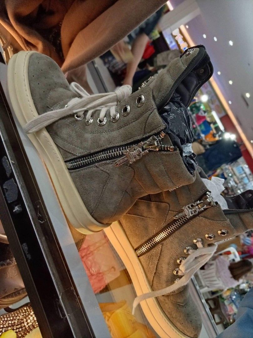 Chrome Hearts High Top Sneakers Grey Suede (Category: Sneakers) located in Cainta. Submitted by riszizlux (Listing ID 1468780861, Image 3). Description: - Brand: Chrome Hearts - Style: High-top sneakers in grey suede - Hardware: Silver cross details on tongue and heel, plus horseshoe lace lock - Features: Side zippers, cream laces, and thick white rubber soles - Condition: Normal wear on soles and uppers - Vibe: Heavy streetwear statement piece.