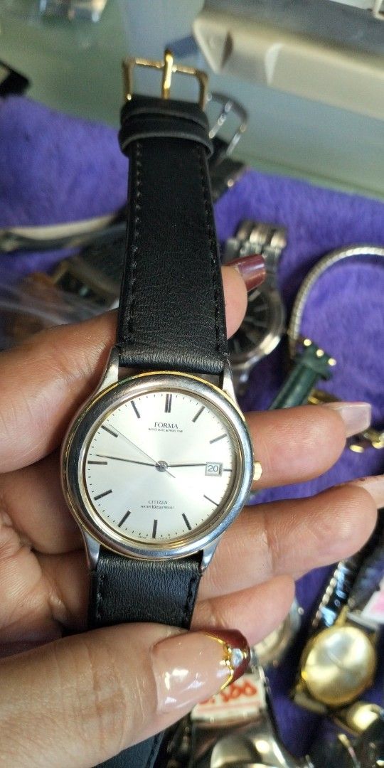 Citizen Forma Two-Tone Watch Black Leather Strap (Category: Women's Watches) located in General Mariano Alvarez. Submitted by ma.miafajardo1219 (Listing ID 1468925588, Image 2). Description: - Brand: Citizen Forma - Movement: Quartz - Case: Two-tone silver and gold - Dial: Cream with thin black index markers and 3 o'clock date window - Strap: Black leather with gold-tone buckle - Condition: Clean crystal and dial face.