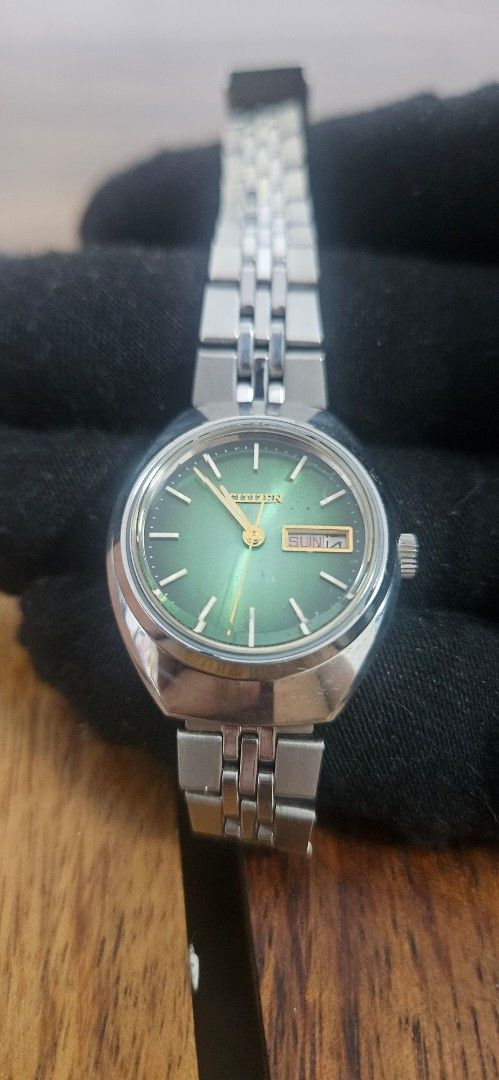 Citizen Vintage Green Dial Automatic Watch (Category: Women's Watches) located in Santa Maria. Submitted by rommelmateo (Listing ID 1468863157, Image 2). Description: - Vintage Citizen automatic watch - Eye-catching vibrant green sunburst dial - Durable stainless steel case and matching bracelet - Convenient day and date window at 3 o'clock - Automatic movement with an exhibition caseback - Iconic Citizen logo-stamped crown - Classic retro design