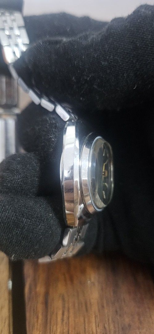 Citizen Vintage Green Dial Automatic Watch (Category: Women's Watches) located in Santa Maria. Submitted by rommelmateo (Listing ID 1468863157, Image 3). Description: - Vintage Citizen automatic watch - Eye-catching vibrant green sunburst dial - Durable stainless steel case and matching bracelet - Convenient day and date window at 3 o'clock - Automatic movement with an exhibition caseback - Iconic Citizen logo-stamped crown - Classic retro design