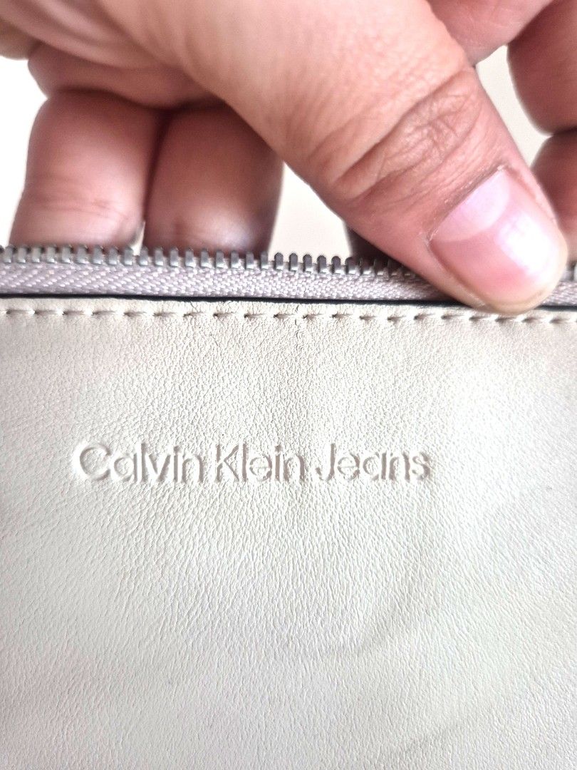 CK pouch (Category: Purses & Pouches) located in Manila. Submitted by mommynurse (Listing ID 1468789245, Image 1). Description: Original CK pouch but with flaws..