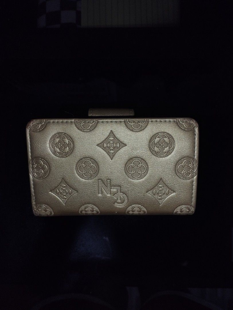 CLN Metallic Gold Patterned Women's Wallet (Category: Wallets & Card holders) located in San Carlos. Submitted by t6kyo (Listing ID 1468807653, Image 2). Description: - Brand: CLN - Color: Metallic gold with debossed patterns and monogram detailing - Closure: Secure magnetic snap on front flap - Interior features: Multiple card slots and an ID window - Condition: Minor edge wear on corners and folds from regular handling - Perfect for daily use o