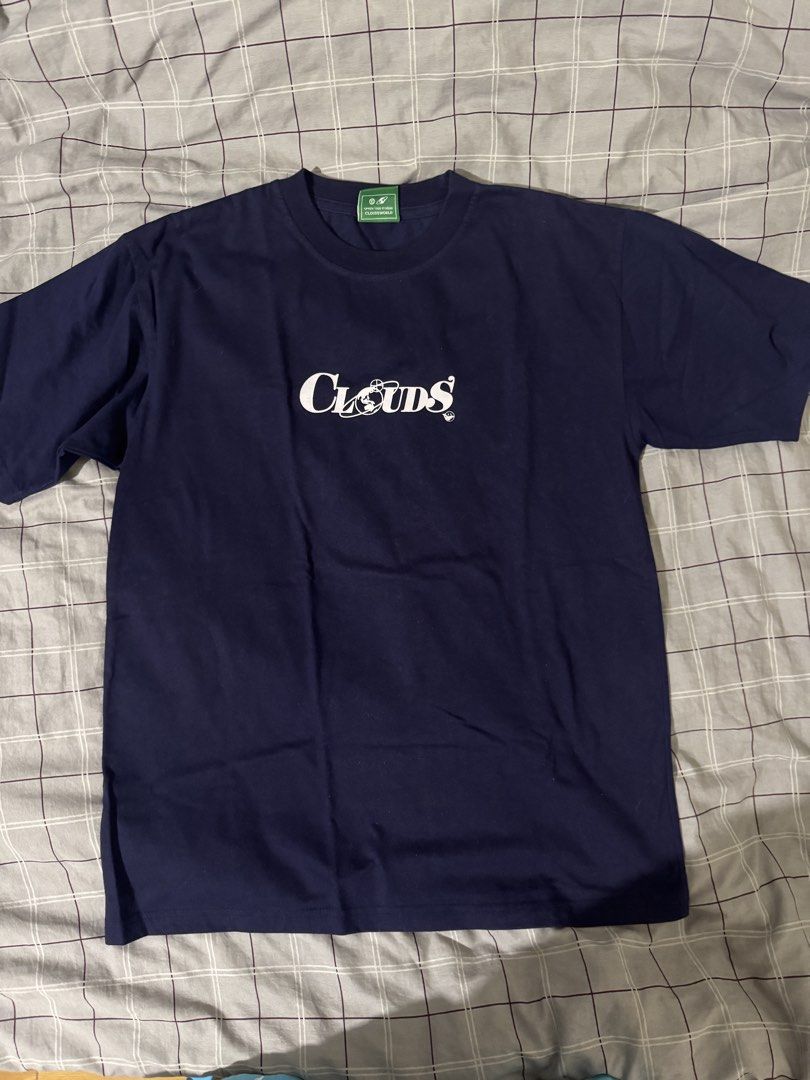 Clouds Navy Blue T-Shirt (Category: Tshirts & Polo Shirts ) located in Davao. Submitted by phdalagan344130 (Listing ID 1468797470, Image 1). Description: - Brand: Cloudsworld - Color: Navy blue with white chest text graphic - Fit: Standard fit, crew neck - Details: Green brand tag inside the collar - Condition: Excellent, clean fabric with no stains or fading Dimes 21x27.