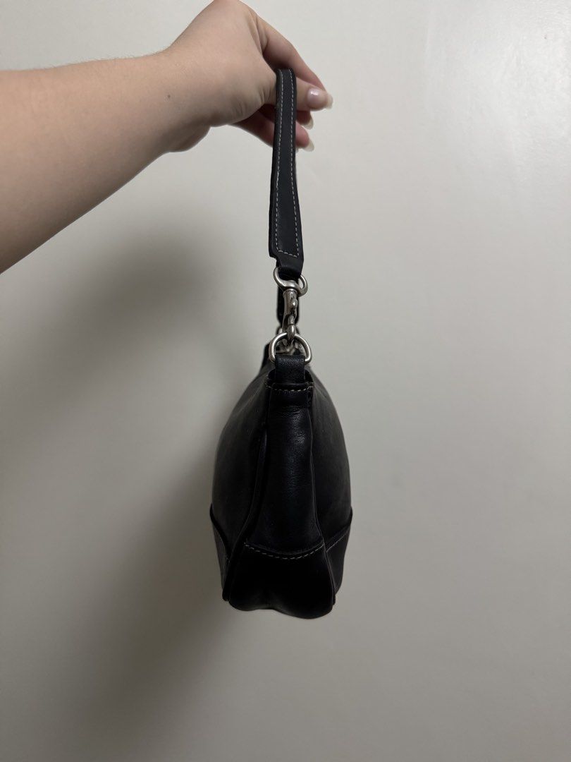 Coach Black Leather Demi (Category: Luxury Bags & Wallets) located in Pasig City. Submitted by sixnine52300172 (Listing ID 1468772327, Image 3). Description: Demi black leather Issue is replaced hangtag, sign of use and replaced strap. .